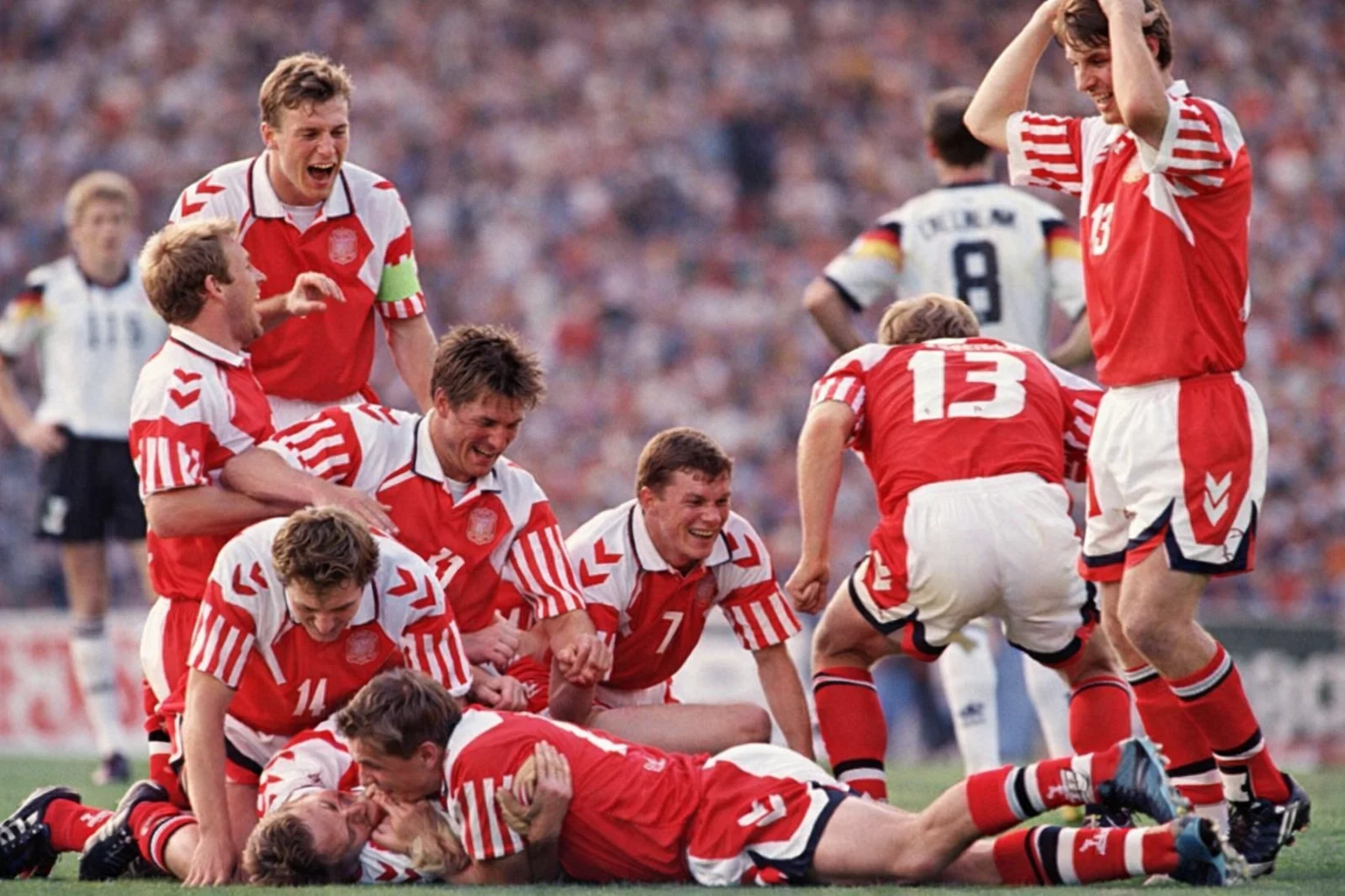 Danish players celebrate on the pitch after beating Germany 2-0 in the Euro 92 final — the most improbable championship in football history